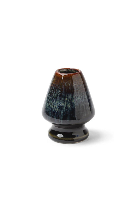 Ceramic matcha whisk stand with dark blue-green glossy glaze and rounded base