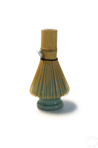Matcha whisk bristles over Seiji green ceramic stand