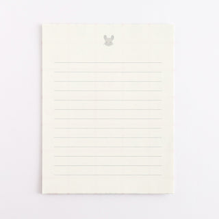 Cream lined memo paper with a small grey rabbit icon at the top