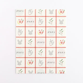 Pack of patterned letter sheets with grid cat, tulip, and paw print icons