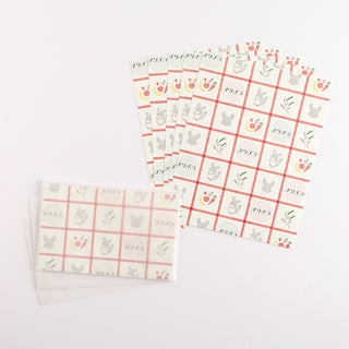 Letter set with patterned sheets and matching envelopes featuring cat and paw motif