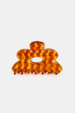 Honey tortoiseshell flower claw hair clip with open center cutout.