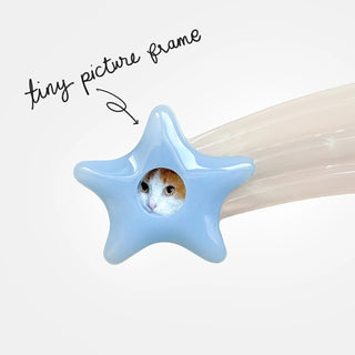 Light blue shooting star hair clip with star-shaped end and rhinestones