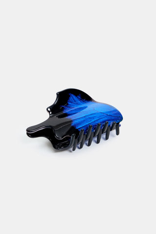 Swallowtail butterfly claw hair clip with blue wing detail and black comb teeth