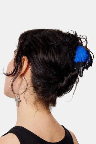 Swallowtail butterfly claw hair clip on dark hair, blue wing detail