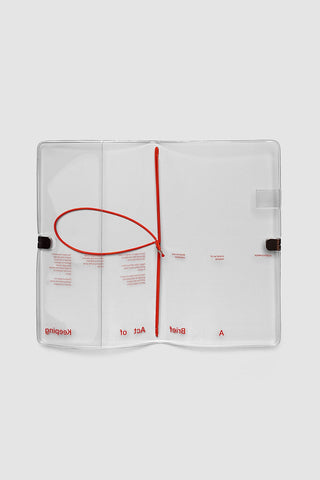 A5 slim travel notebook cover with clear vinyl and red elastic cord closure