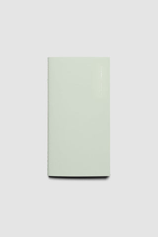 Sage green travel notebook with smooth cover and weekly graph layout