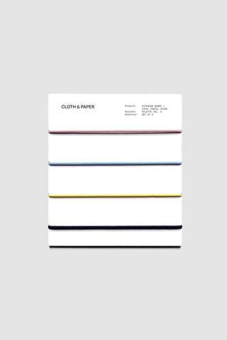 Vinyl travel cover with horizontal exterior color bands in pink, blue, yellow, and navy