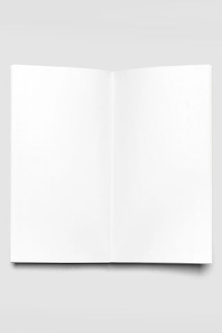 Slim blank travel notebook, open pages with clean white sheets