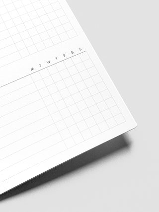 White printed routine planner page corner with grid lines and chart