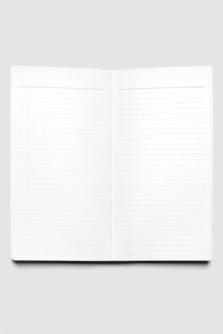 A5 slim travel notebook opened to lined pages with dot margin and central spine
