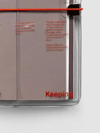 Clear vinyl notebook cover side view with black clip and red cord