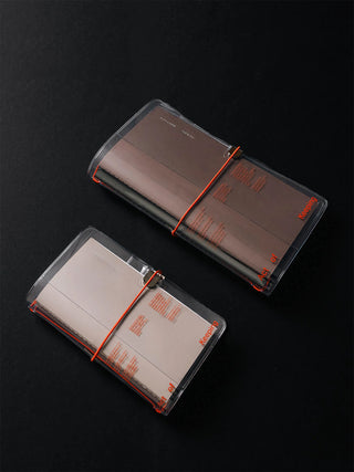 Open A5 clear vinyl notebook cover with red cord ties and internal panels