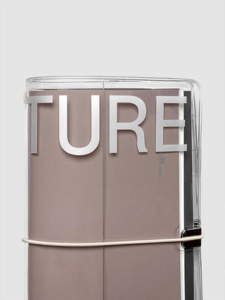 Clear vinyl A5 notebook cover with dark interior pages and elastic strap