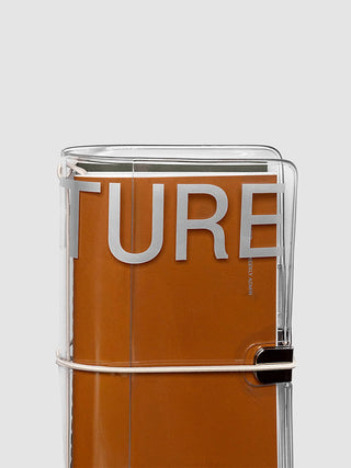 Clear vinyl notebook cover with orange paper insert and metal corner rings