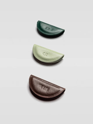 Mini magnetic bookmark set with three curved half-moon magnets in dark green, light green, brown