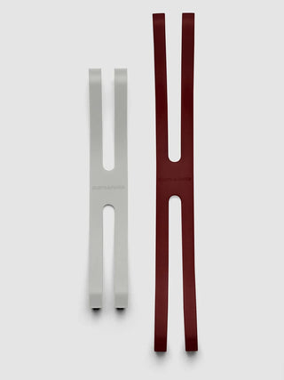 Notebook closure bands, burgundy and light gray pairs with oval cutout slots