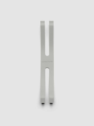 Light gray notebook closure bands, two long straps with oval cutouts