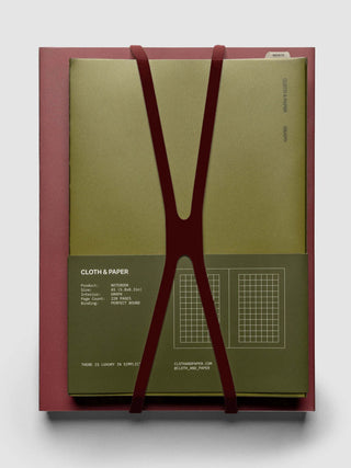 Notebook set with maroon V-shaped closure bands and two paper covers