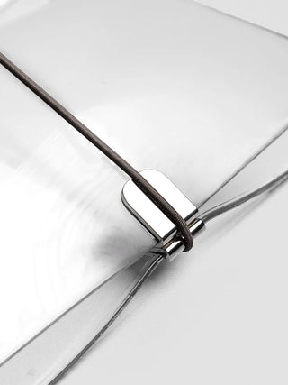 Close-up of vinyl travel cover bands with black cord and metal rings