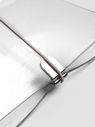 Close-up of vinyl travel cover band with black cord and metal snap hardware