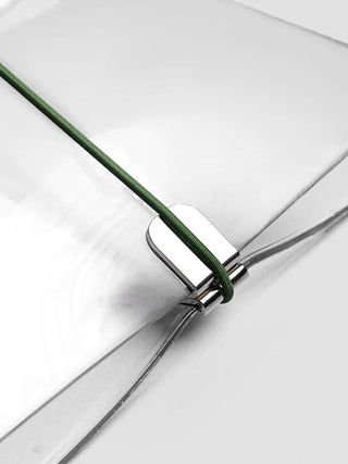 Close-up of vinyl travel cover band with green cord and metal rings