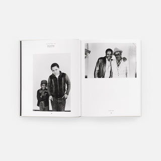 Open monograph book spread with black-and-white family portraits on two pages