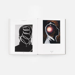Open monograph book spread with two black-and-white portrait photos on facing pages