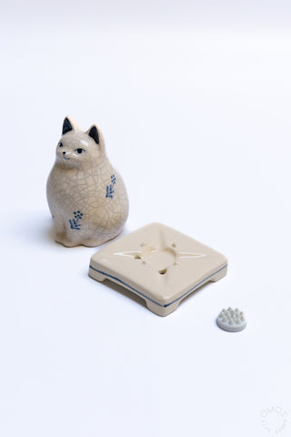 Crackle porcelain cat incense burner with square holder showing central incense well