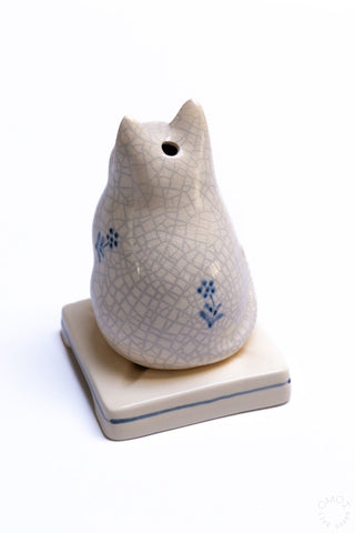 Back view crackle porcelain cat incense burner with blue flower motifs and top hole