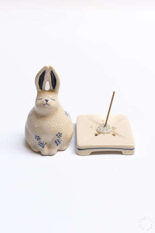 Rabbit-shaped crackle porcelain incense burner with incense stick on square tray base