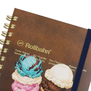 Large spiral notebook close-up: Rollbahn logo and colorful ice-cream print