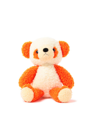 Orange-and-white plush panda toy, sitting pose with black nose and eyes