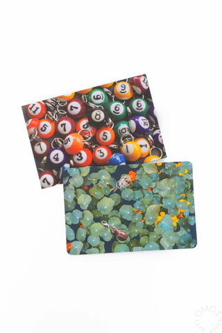 Two postcards: billiard balls design and blue garden mosaic scene