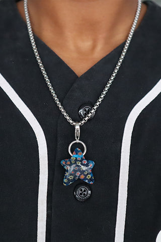 Silver chain necklace with wonky star charm in blue mille fiori enamel