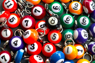 Mini pool charm close-up with assorted round numbered beads and silver rings