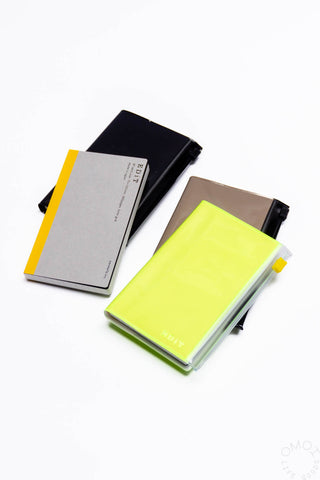 EDiT B7 storage grid notebook, neon yellow cover with elastic; also dark black