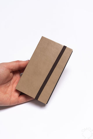 Brown grid notebook with dark elastic band and notebook cover