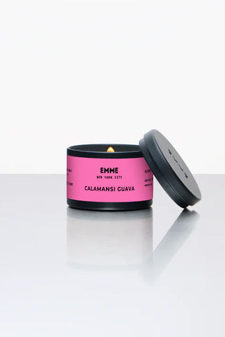 EMME 4oz tin candle in black lid, pink label with Calamansi Guava scent