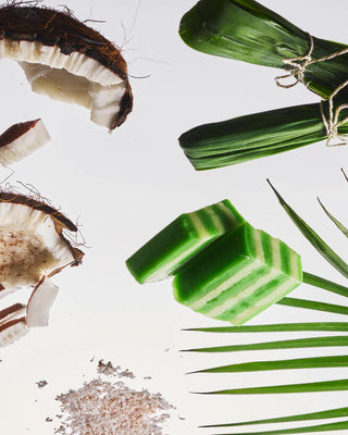 Green pandan leaves and wax-like coconut chunks with scattered shavings