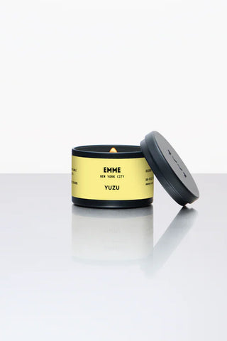 Yuzu tin candle with yellow label and dark lid, jar open