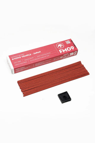 Red incense stick bundle with black square holder and FM09 box