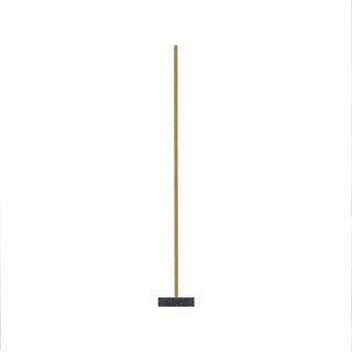 Single thin incense stick with a dark tip on a pale background.