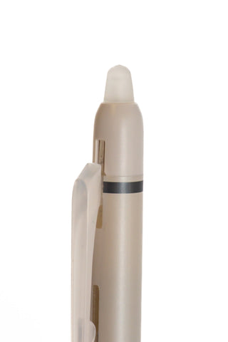 Erasable pen refill tip close-up with frosted beige body and dark band