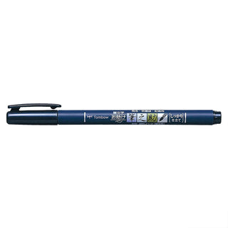 Dark blue brush pen with printed barrel and removable black grip cap
