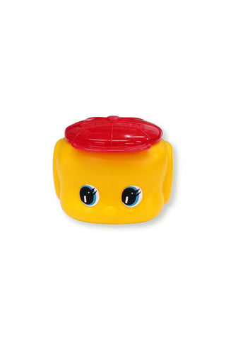 Yellow glue dispenser with red round lid and smiling cartoon eyes