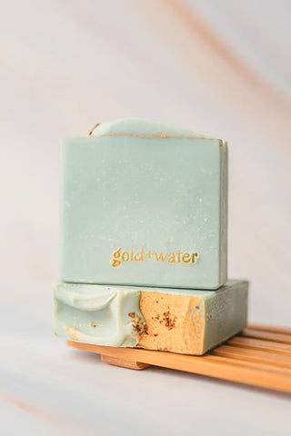Handcrafted mint-green soap bar set with goldwater logo and tan center detail