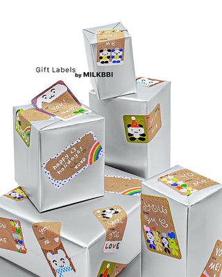 Kraft gift labels with cute animal designs attached to silver gift boxes