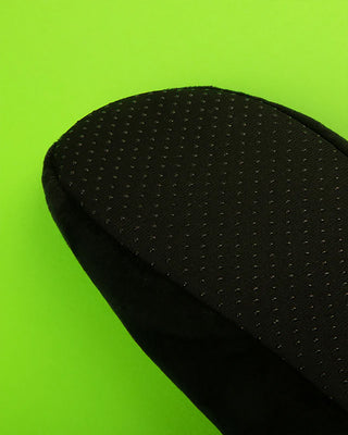 Close-up of black rest room shoe upper with textured dotted surface