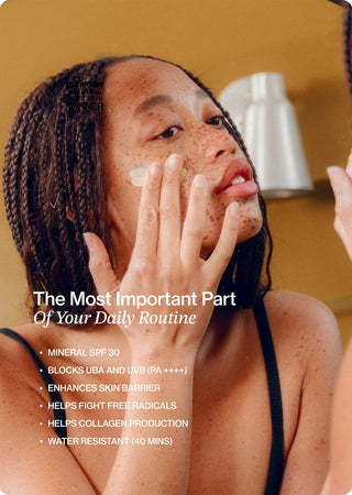 Mineral sunscreen SPF 30 being applied to face with a white cream layer